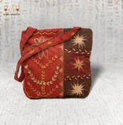 Front view of the City Pearl handwoven bag with floral and geometric embroidery in red and brown tones.