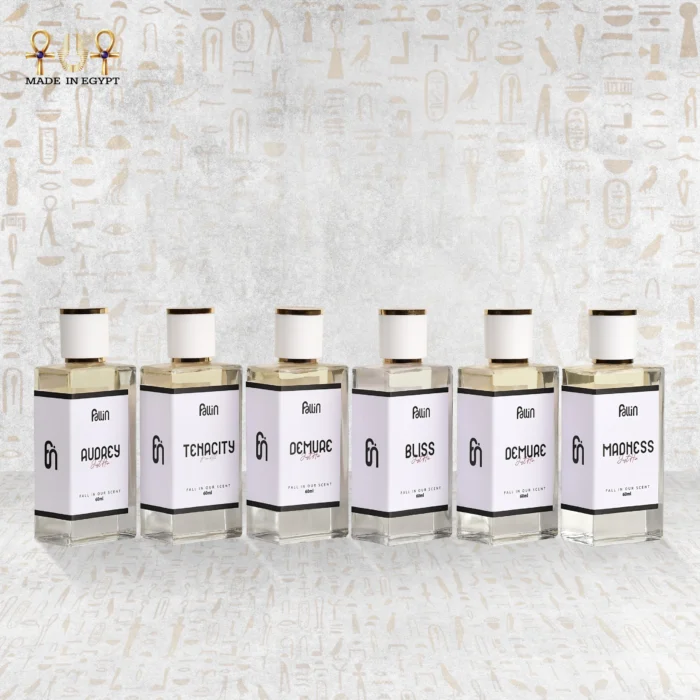 Fallin perfume collection featuring Audrey, Tenacity, Demure, Bliss, and Madness bottles – Made in Egypt.