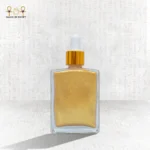 Dry Shimmer golden bottle perfume oil for skin, hair, and body with lightweight formula