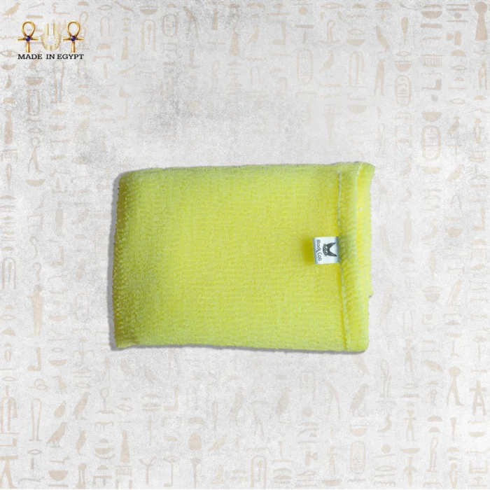 Close-up of Yellow Deep Exfoliating Towel by Black Cat, showcasing its texture and brand label.