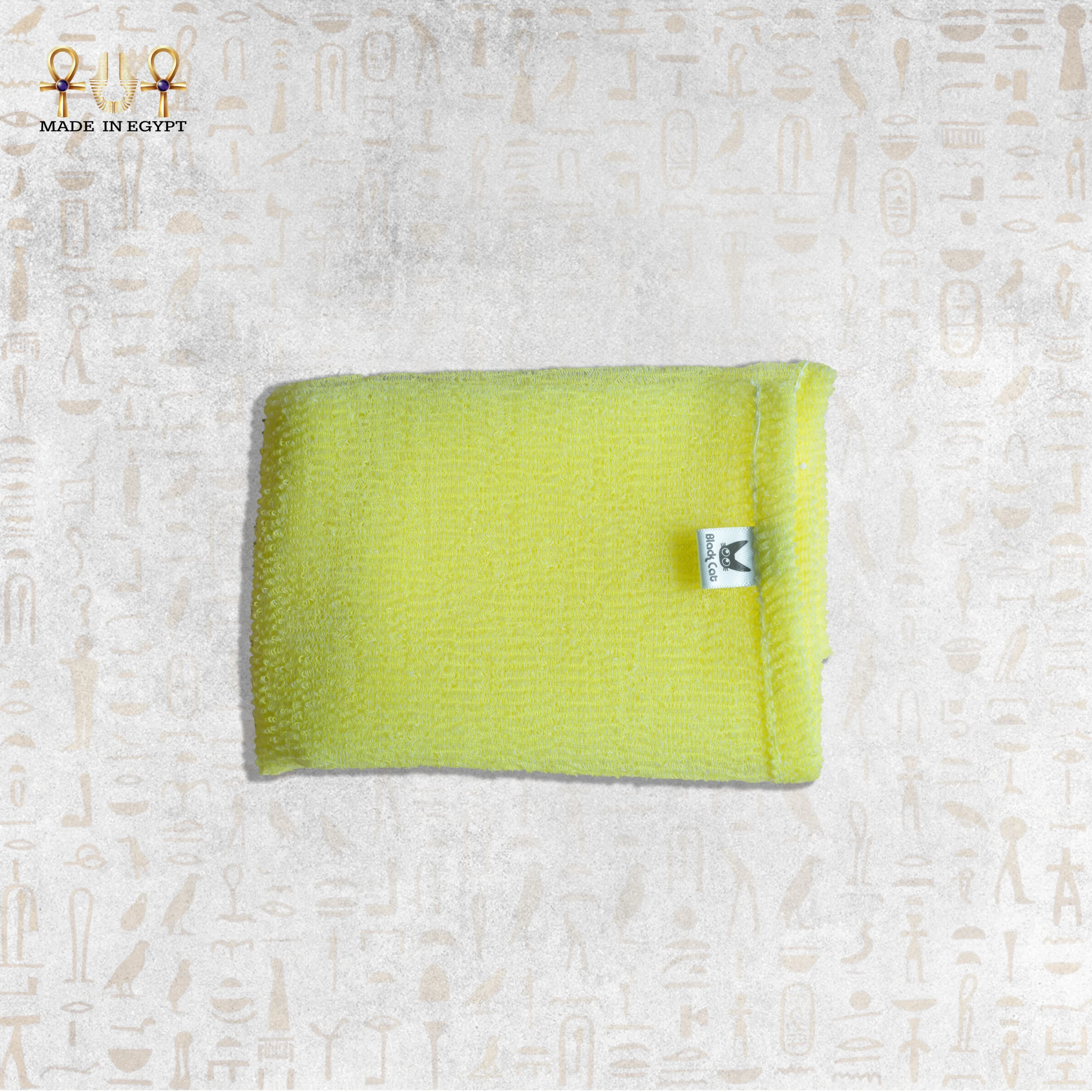 Close-up of Yellow Deep Exfoliating Towel by Black Cat Close-up of Yellow Deep Exfoliating Towel by Black Cat, showcasing its texture and brand label.