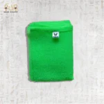 Close-up of Green Deep Exfoliating Towel by Black Cat showing its texture and brand label.