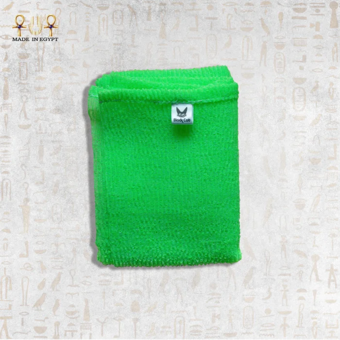 Close-up of Green Deep Exfoliating Towel by Black Cat showing its texture and brand label.