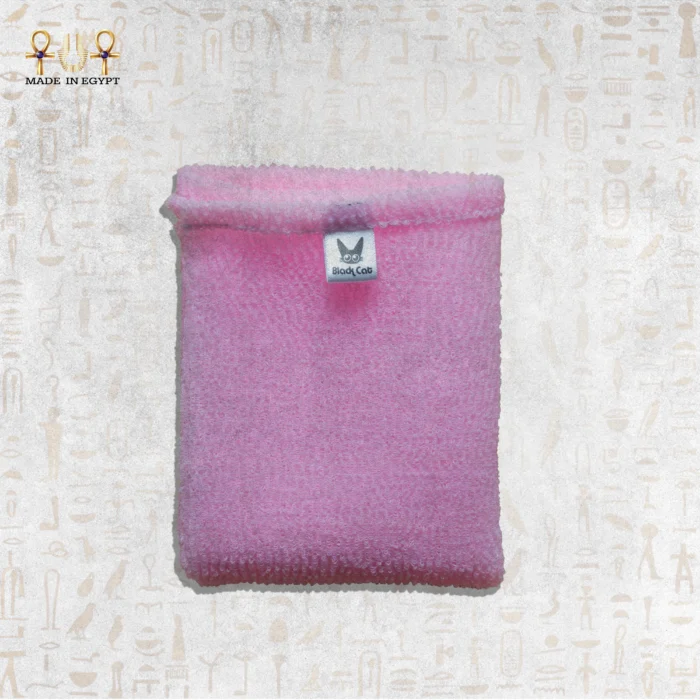 Close-up of Pink Deep Exfoliating Towel by Black Cat, showcasing the texture and brand label.