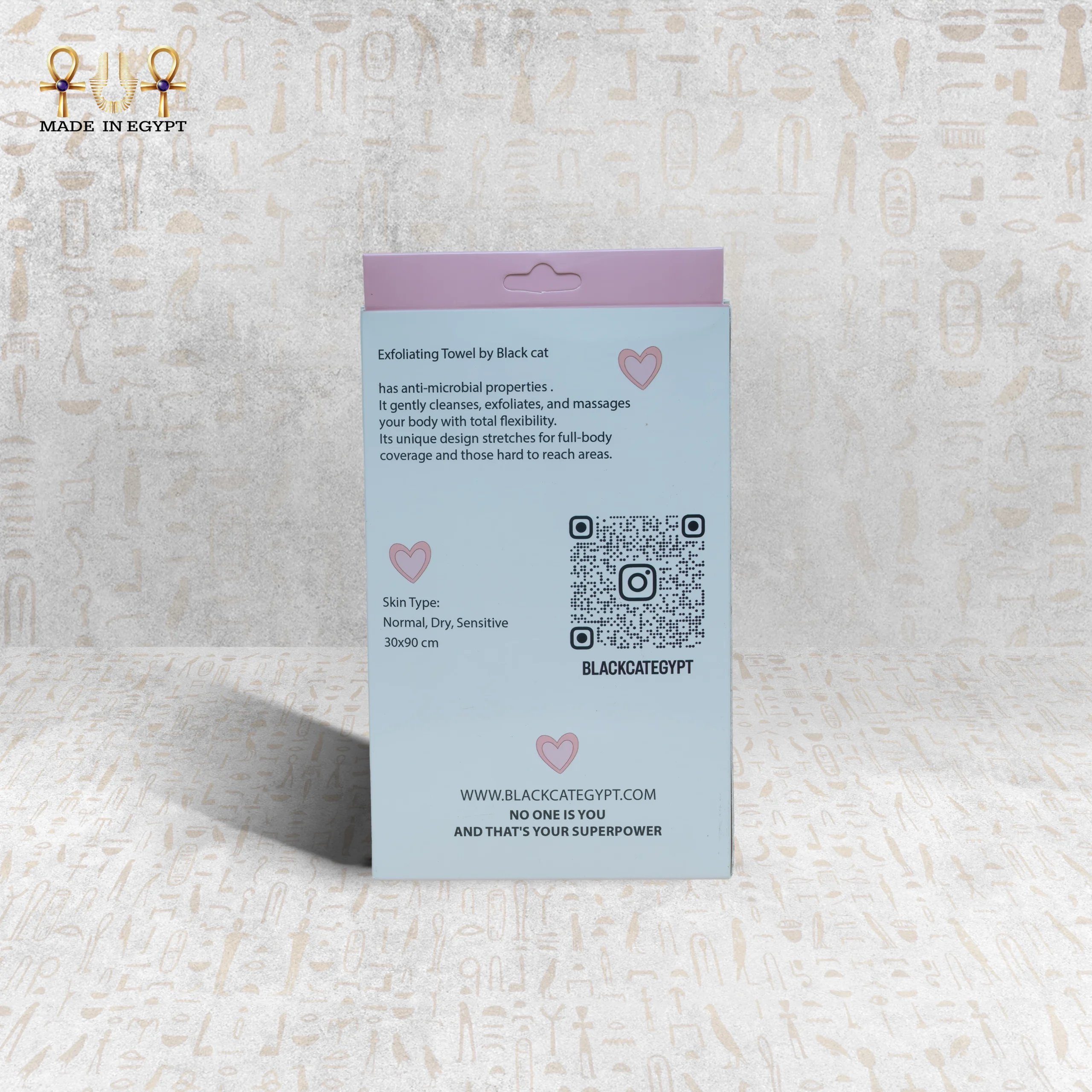 Pink Deep Exfoliating Towel Back View by Black Cat Back view of Pink Deep Exfoliating Towel packaging by Black Cat with product information and QR code.