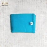 Close-up of Blue Deep Exfoliating Towel by Black Cat showing texture and brand label.