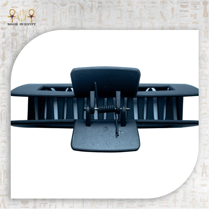 Close-up view of Elegant Grip hair clip showing detailed structure with spring mechanism.