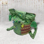 Side View of Emerald Delight Handbag with Bright Geometric Embroidery and Colorful Tassels.