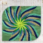 Close-Up of the Hand-Embroidered Flower Design on the Emerald Delight Handbag.