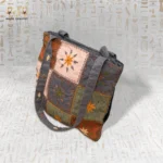 Flower Squares handbag showcasing a mix of vibrant gray, orange, pink, and green colors with intricate embroidery.