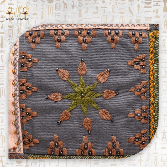 Flower embroidery with shades of green and brown on the Flower Squares bag, showing intricate stitching and beadwork.
