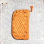 Orange embroidered pouch with tassel and beadwork, showcasing intricate diamond patterns with floral motifs.
