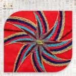 Close-up of the embroidered spiral design on the Joyful Jasmine bag in vibrant threads.