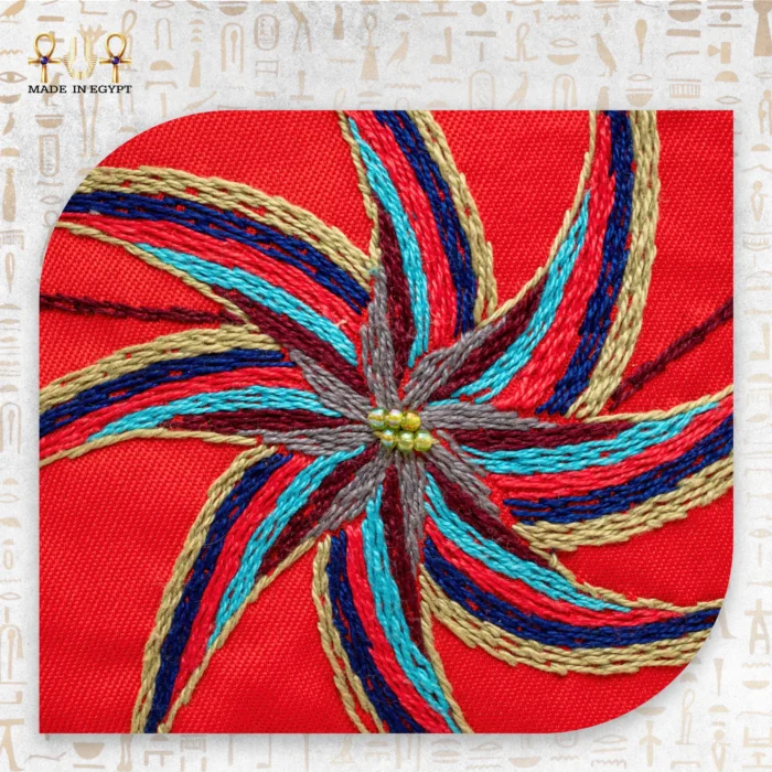 Close-up of the embroidered spiral design on the Joyful Jasmine bag in vibrant threads.