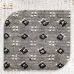 Close-up of the Luxury Surprise clutch's beaded floral pattern, showing black and white beads meticulously arranged.