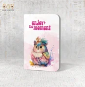 Magical Moment notebook with vibrant watercolor bird and “Enjoy the moment” text, made in Egypt