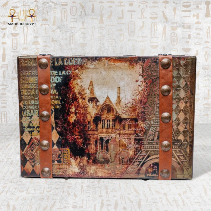 Front view of the Memories Box with vintage building artwork and leather strap details.