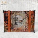 Back panel of the Memories Box with skeleton and bird artwork.