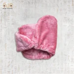 Soft and plush pink microfiber towel folded neatly with a button fastening.