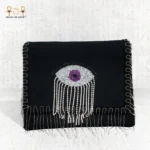Front view of the Mysterious Gaze bag with purple beaded eye motif and silver crystal fringes.