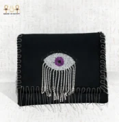 Front view of the Mysterious Gaze bag with purple beaded eye motif and silver crystal fringes.