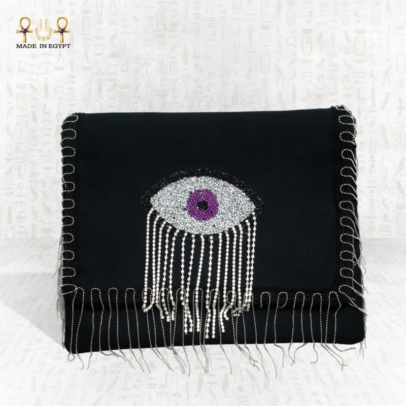 Front view of the Mysterious Gaze bag with purple beaded eye motif and silver crystal fringes.
