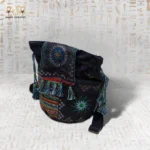 Another angle of the Night Delight handwoven embroidered bag, highlighting the geometric design and tassel details.