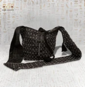 Full view of the "Night Mirror" handbag with intricate black and white beadwork, showing its long strap.