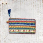 Nubian Delight pouch with intricate multi-colored embroidery, featuring red, blue, yellow, and green beads with a blue tassel.