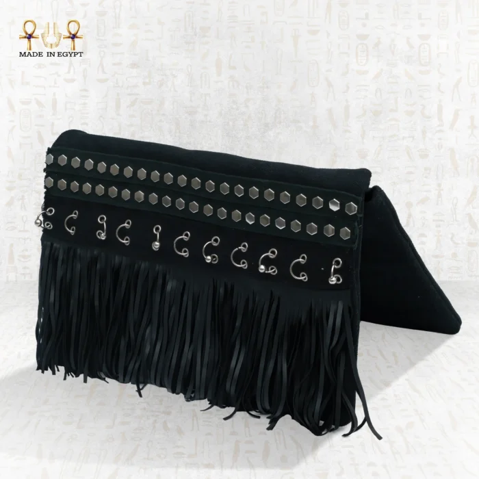 Side view of the Pharaoh’s Touch bag with black fringes, silver embellishments, and bold handcrafted details.