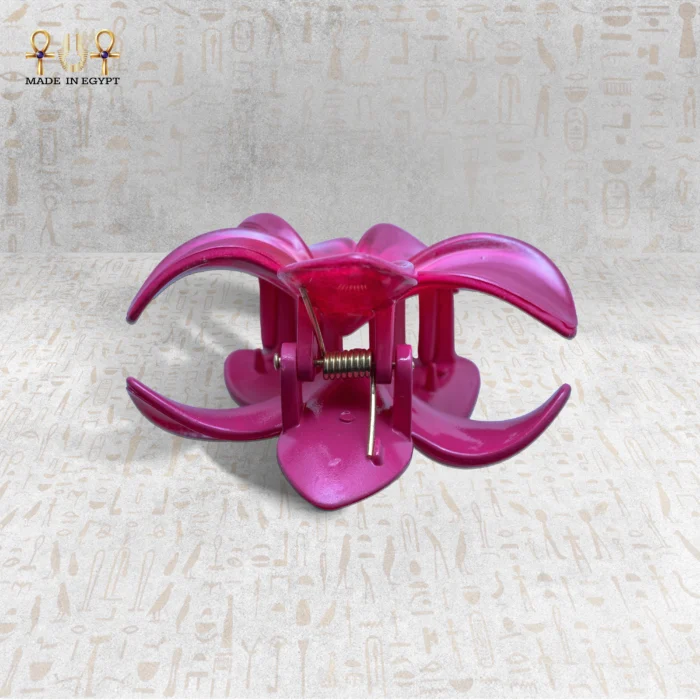 Pink flower-shaped clasp with a spring mechanism, viewed from the front.