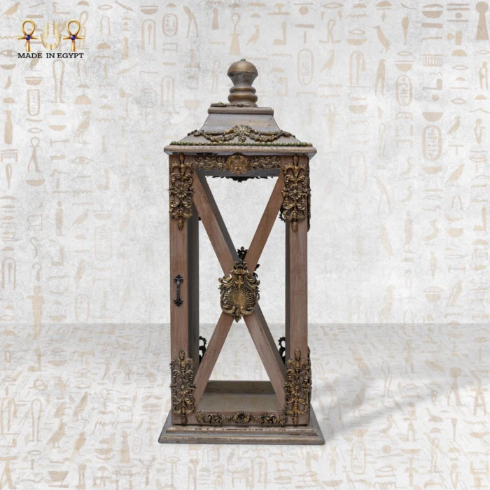 Tall handcrafted wooden lantern with detailed golden carvings and antique finish.
