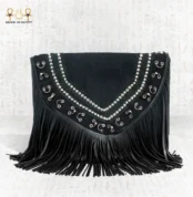 Close front view of the Royal Shadow bag displaying its silver decorative patterns and bold black fringes.