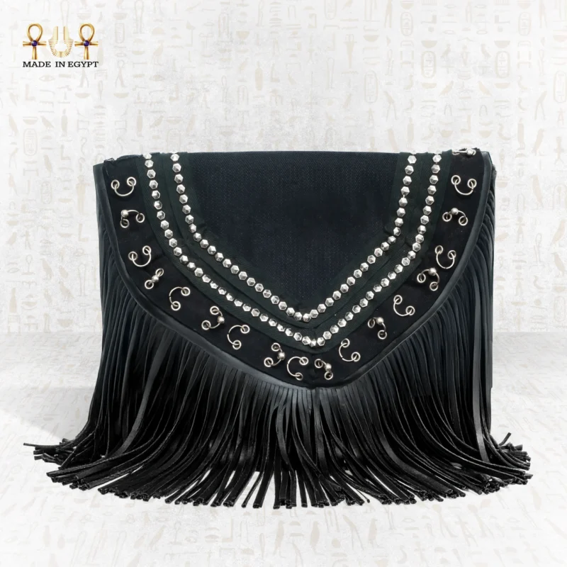 Close front view of the Royal Shadow bag displaying its silver decorative patterns and bold black fringes.