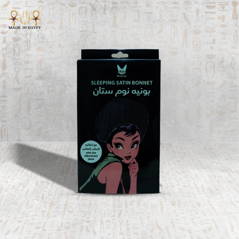 Satin Magic sleeping bonnet packaging front view – black design with cartoon illustration.