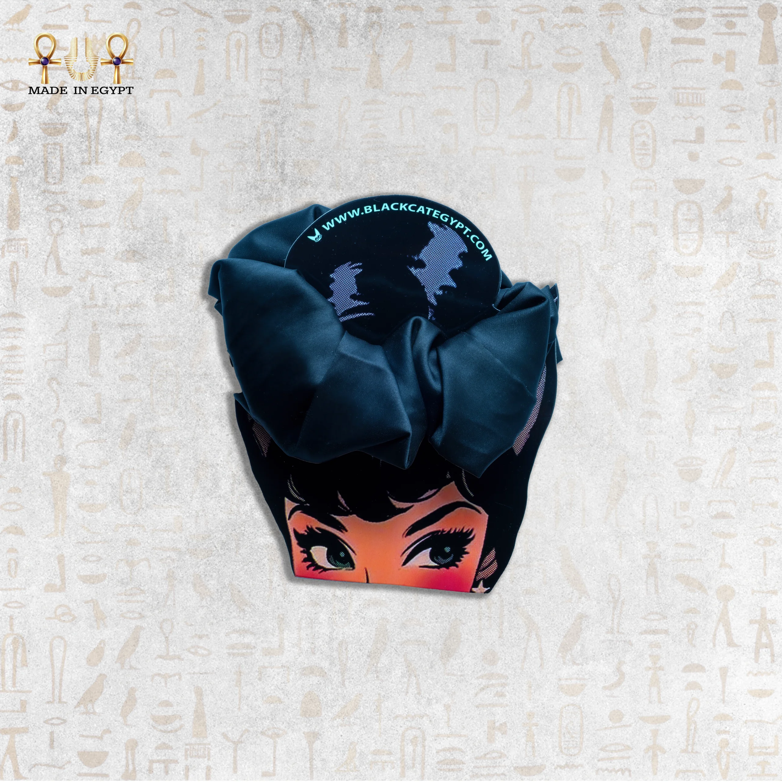 Stylish Black Silk Hair Tie with Unique Cartoon Packaging Black silk hair tie with cartoon packaging design.