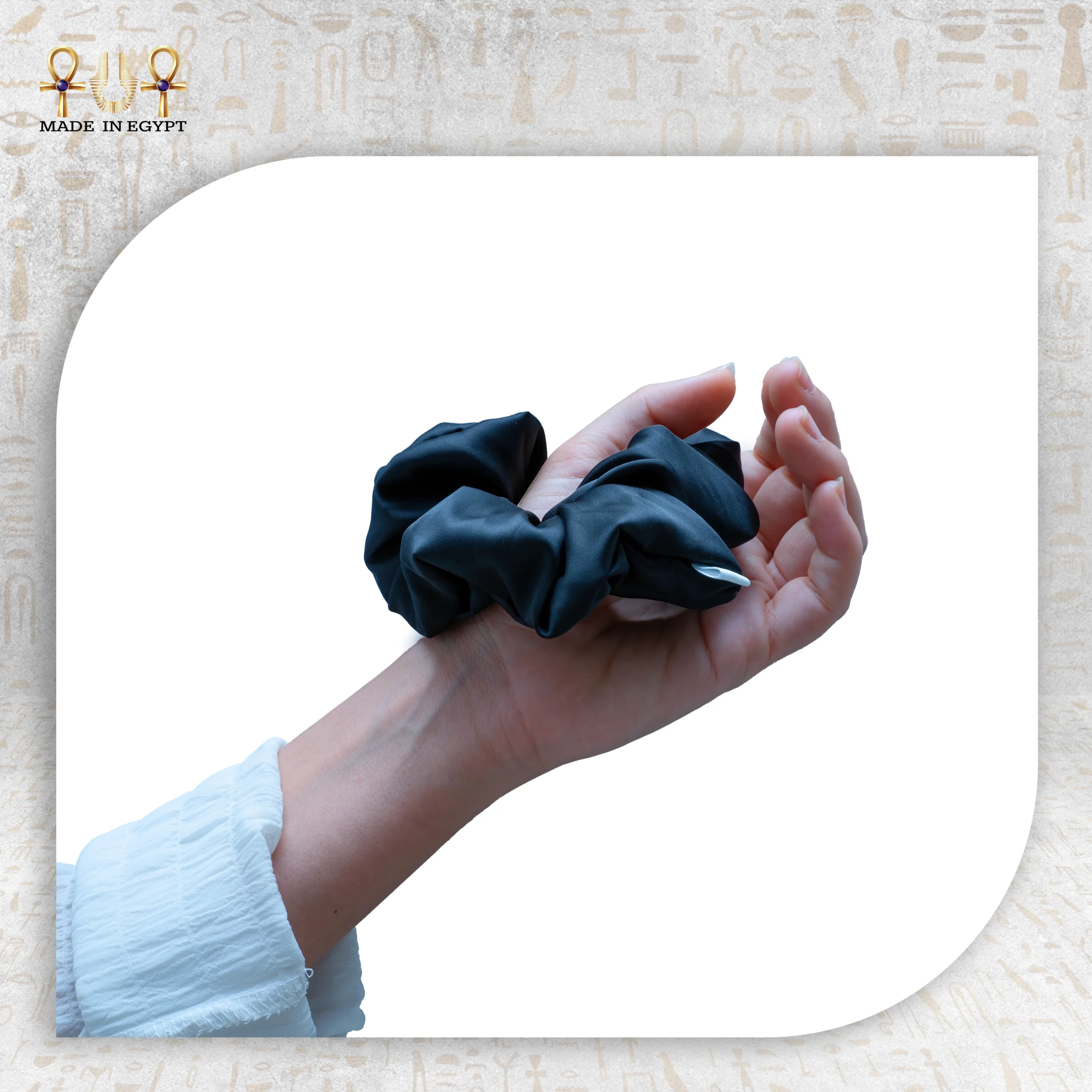 Black Silk Hair Tie for Luxurious Hair Styling Silk black hair tie held in a hand, perfect for elegant hairstyles.