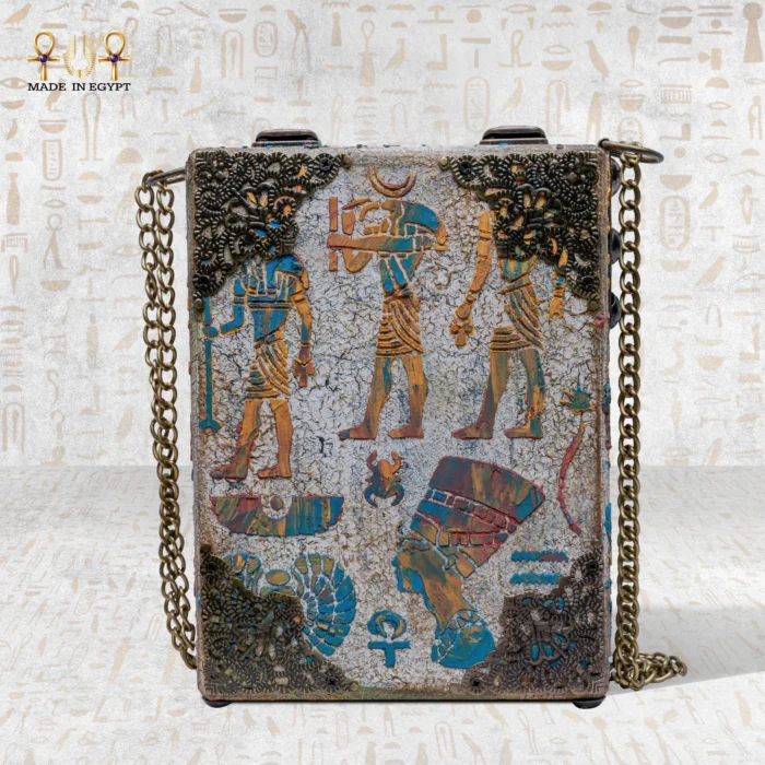 Back view of the Soul Sun bag featuring ancient Egyptian figures, Nefertiti profile, and symbolic carvings.