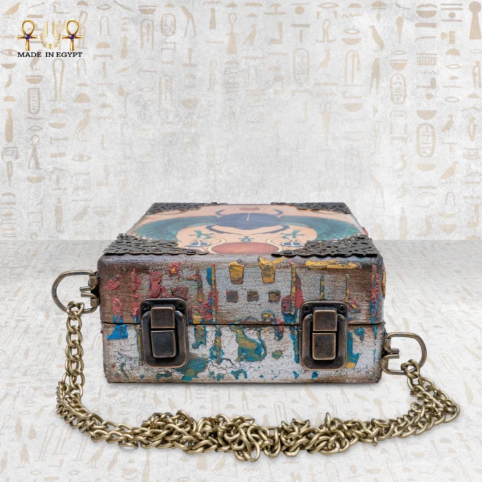 Flat bottom view of the Soul Sun handmade wooden bag with brass locks and chain.