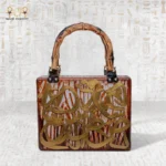 Wooden handbag with engraved Arabic calligraphy and bamboo handle