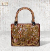 Wooden handbag with engraved Arabic calligraphy and bamboo handle