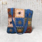 Star Ornament handcrafted handbag made from durable fabric, featuring vibrant star embroidery and modern design with spacious interior.