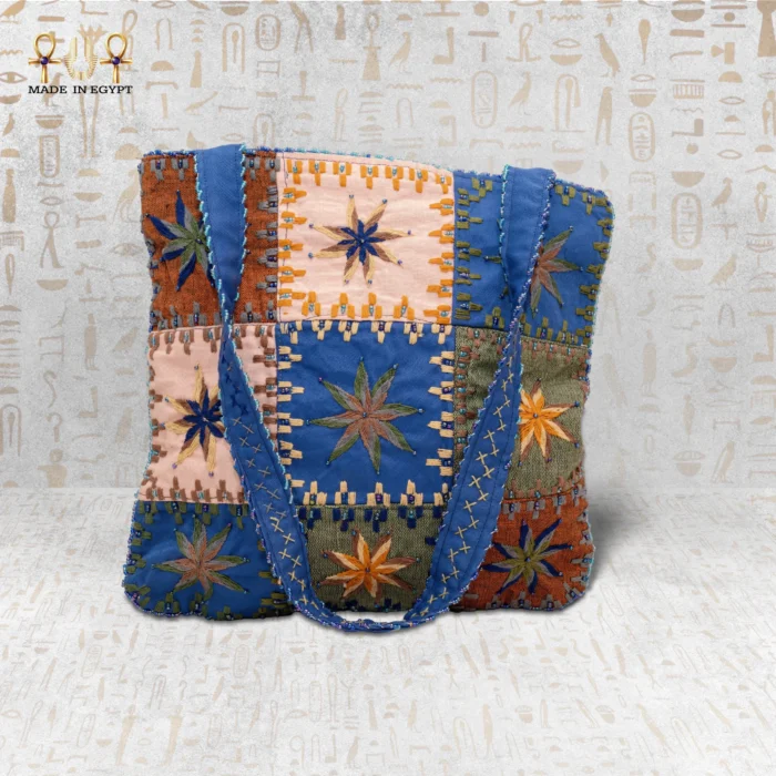 Star Ornament handcrafted handbag made from durable fabric, featuring vibrant star embroidery and modern design with spacious interior.