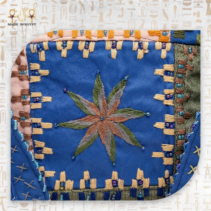 Star Ornament close-up of handcrafted handbag with intricate star embroidery, made from durable fabric and featuring a spacious interior.