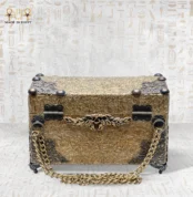 Front view of the Sultana handcrafted Egyptian bag, designed like an antique “shakmagia” chest with gold detailing and brass chain.