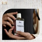 Tenacity perfume bottle with golden accents and floral notes