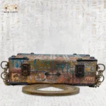 Flat view of The Key to Modesty bag showing hieroglyphic engravings and metal locks