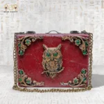 Handcrafted wooden “The Zodiac Sage” bag with ornate owl motif and green gemstone accents.