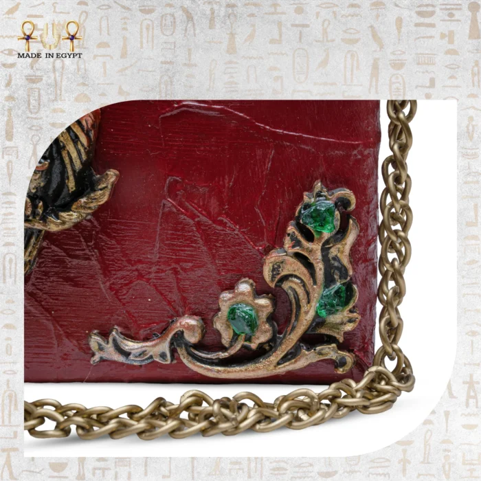 Floral metallic detail with green gemstones on The Zodiac Sage wooden shoulder bag.