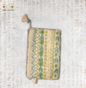 Top view of the "Turquoise Oasis" bag featuring intricate beadwork in turquoise, green, and gold, with a tassel zipper pull.